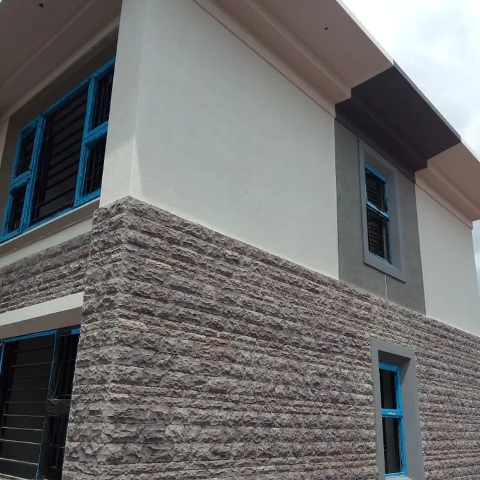 Grey bush cladding on the corner of a house